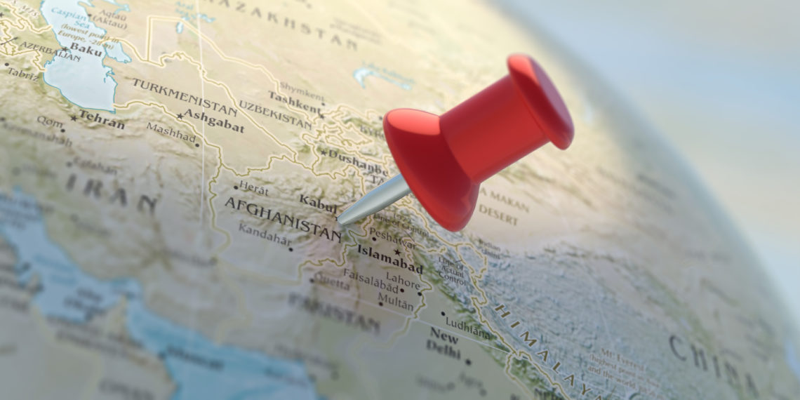 Islamic Republic of Afghanistan. Afganistan pinned on World atlas, close up view. Red map location pointer on globe planet Earth. 3d illustration.