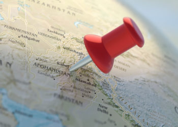 Islamic Republic of Afghanistan. Afganistan pinned on World atlas, close up view. Red map location pointer on globe planet Earth. 3d illustration.